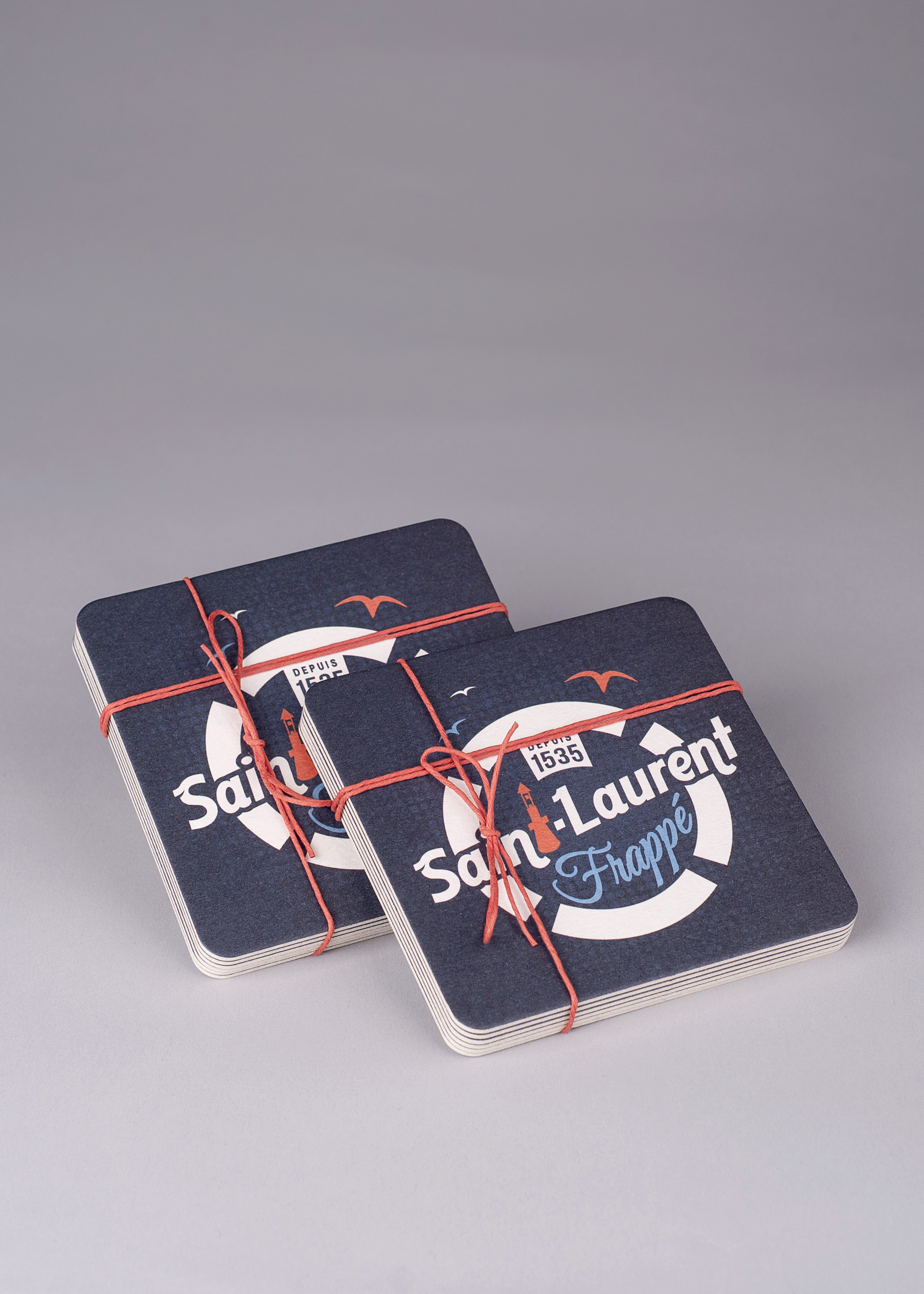 Saint-Laurent frappé coasters, Les Archivistes